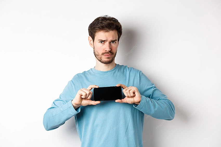 Empty phone screen, person looking disappointed