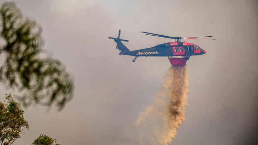 Australia bushfires claim first death as hundreds of homes burn