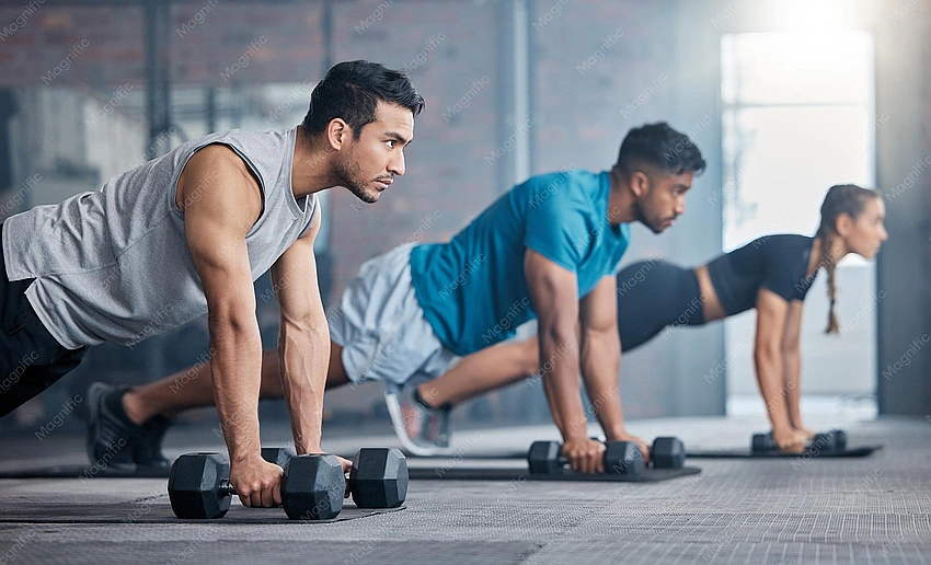 people working out in a gym, focus on athletic wear