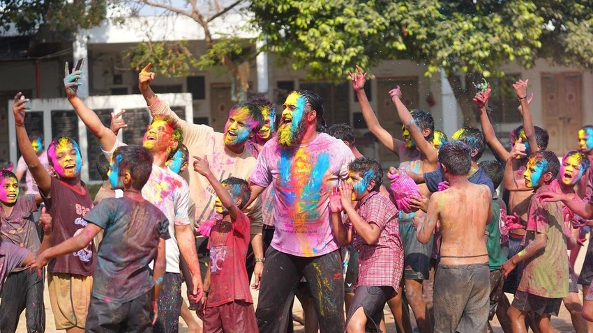 Delhi Holi Celebrations as Families Reunite with Returning Loved Ones