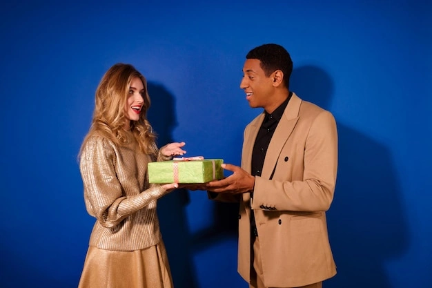 Girl subtly giving a small thoughtful gift to a guy, happy reaction