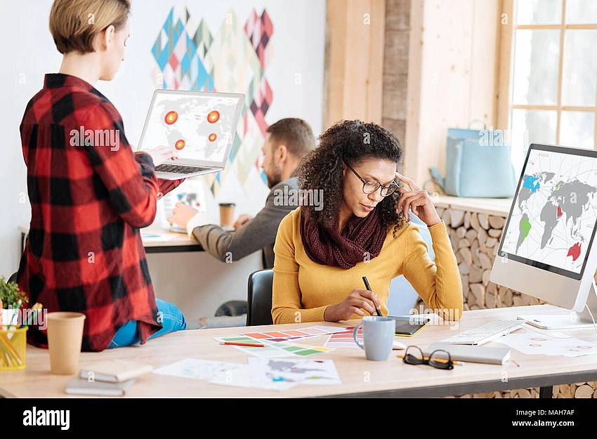 Person looking determined while working on a challenging creative project