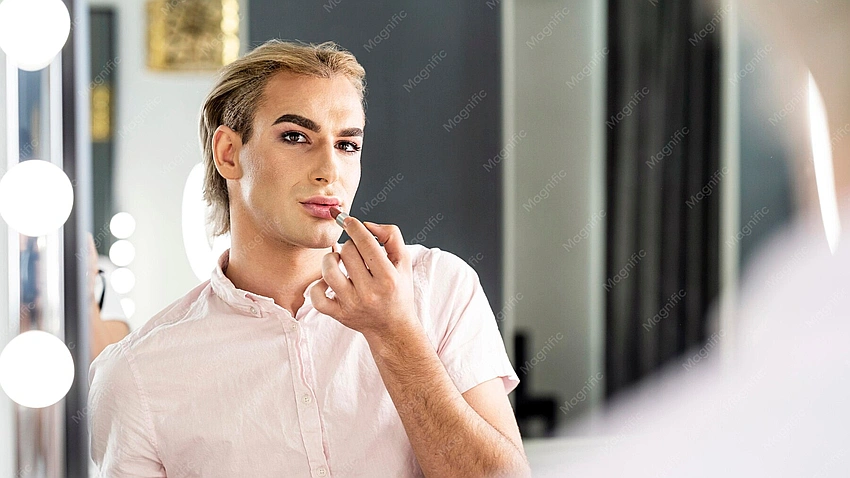 Confident man looking in mirror, subtle makeup, self-expression