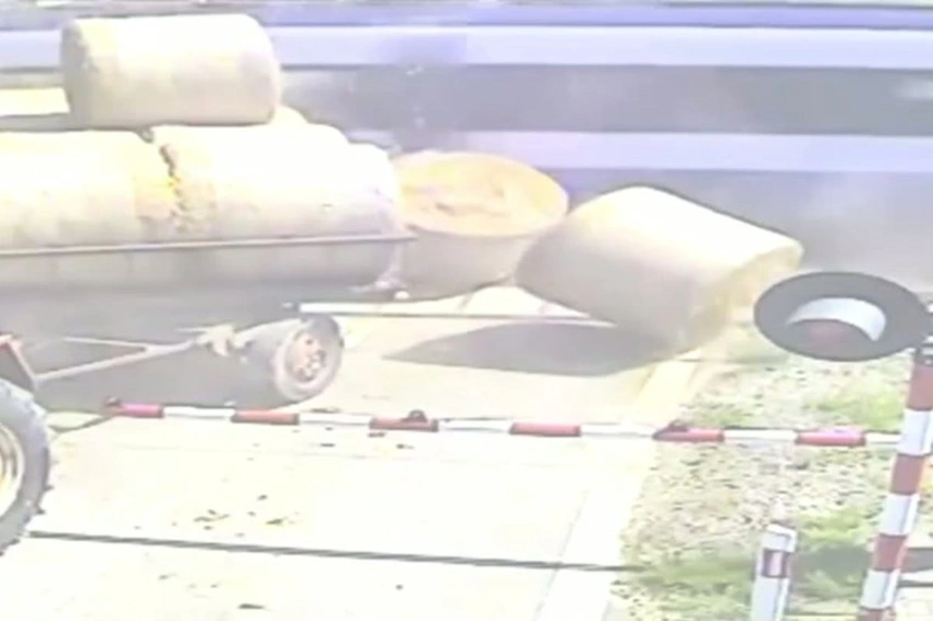 Shocking Moment: Train Smashes Drunk Driver's Trailer on Tracks!