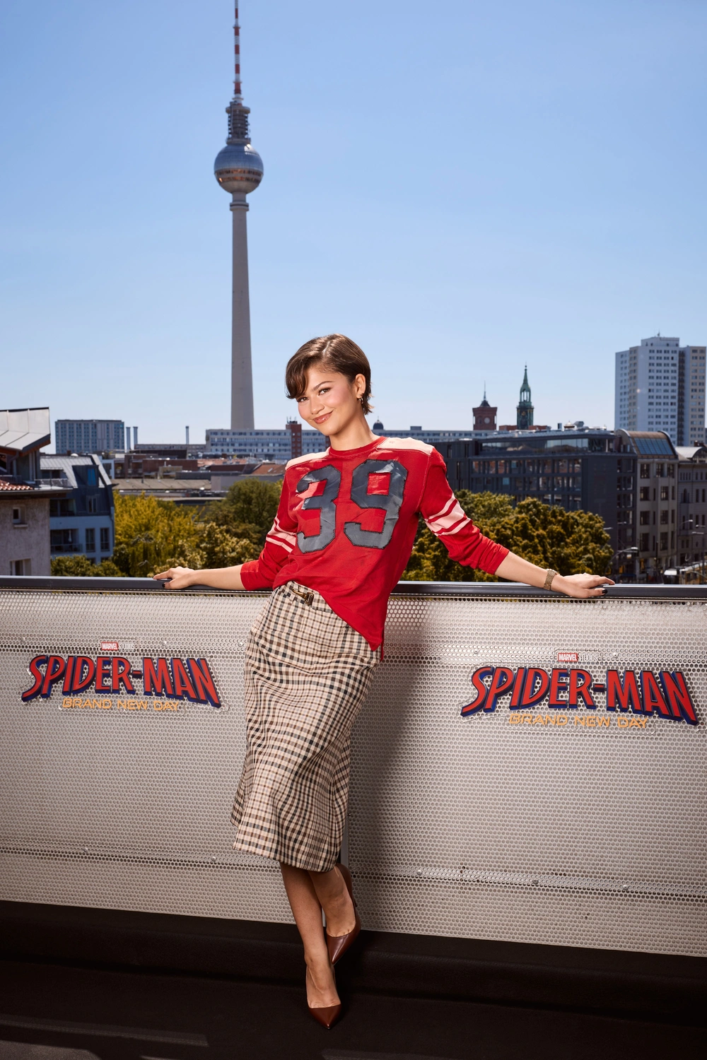 Zendaya Slays Berlin Fashion: The Preppy Sports Jersey Twist!