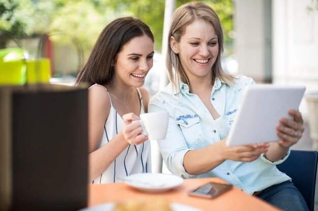 Friends looking at digital photo album on tablet