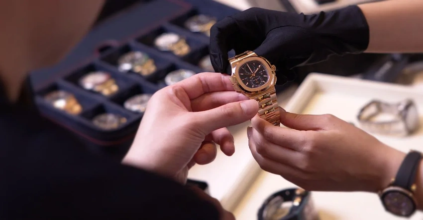 Person buying an expensive watch after a long work period