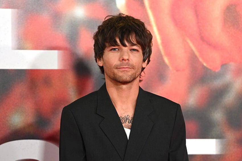 Louis Tomlinson calls One Direction's biggest hit corny, but loves it
