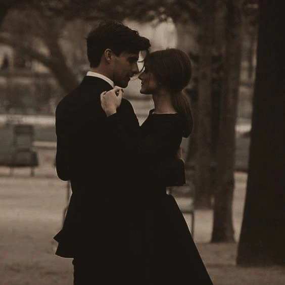 intense couple looking at each other, dark romantic aesthetic