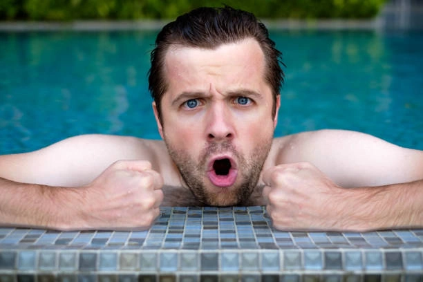 Person looking suspiciously at swimming pool