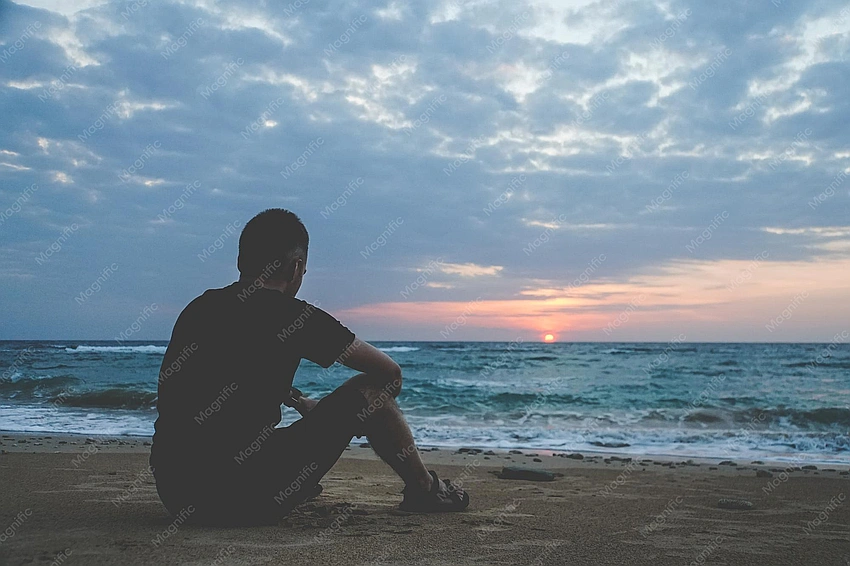 Man nervously looking at ocean from beach