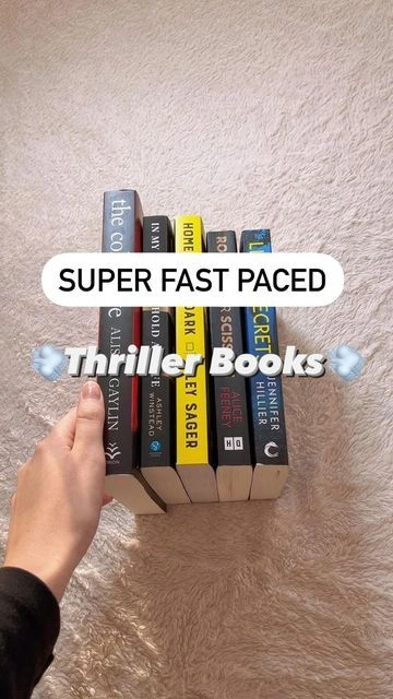 Hand holding small book, fast-paced thriller cover