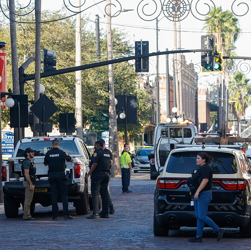 Four dead, 11 injured as car fleeing police slams into Tampa bar crowd