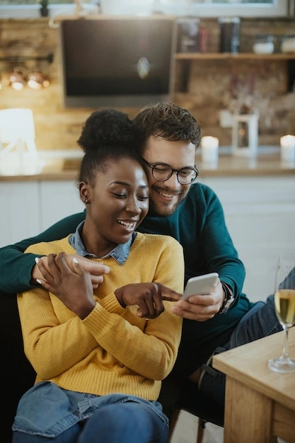couple playfully texting, woman smiling at phone