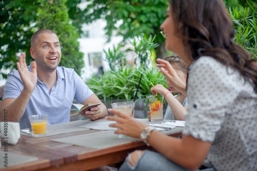 casual cafe meeting, couple with parents, relaxed introduction