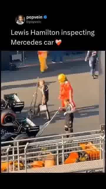 Hamilton checks the mercedes: 

Lewis Hamilton takes a close look at the Mercedes car before hitting
