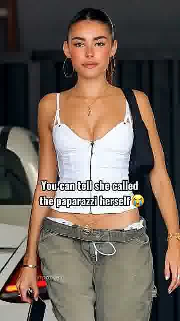 Did she call them?: 

Fans are joking that this paparazzi moment looks a little too perfectly timed.